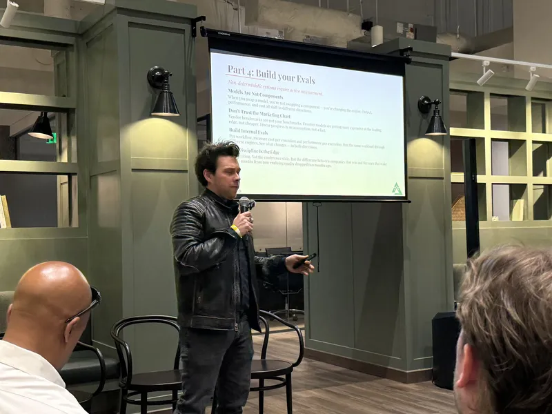 Speaker leading a hands-on Build your Evals session at an Atlanta workshop